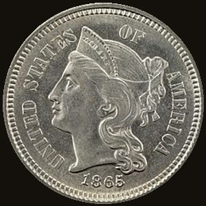 Obverse and reverse of an 1865 three-cent nickel showing Liberty's head and the Roman numeral III in a wreath.