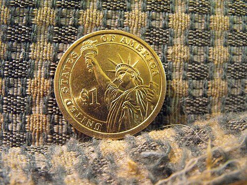 Reverse of a Presidential Dollar.