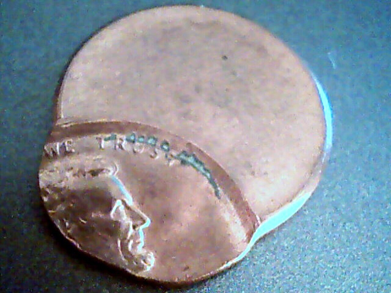 Lincoln cent struck far off-center, leaving part of the planchet blank