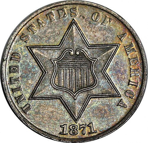 Obverse of an 1871 proof Three-Cent Silver coin, a star with a shield.