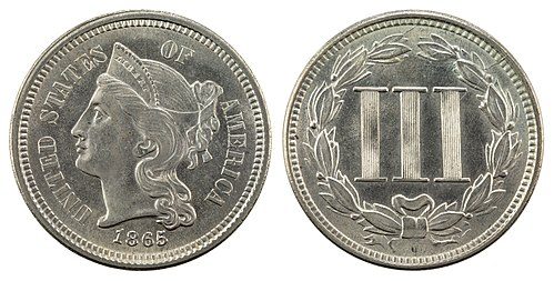 Obverse and reverse of an 1865 three-cent nickel showing Liberty's head and the Roman numeral III in a wreath.