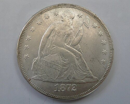 Reverse of a Seated Liberty Dollar.